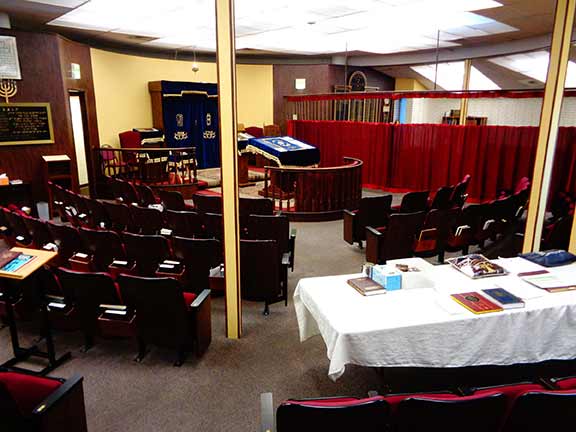 Inside shul separate men's section & separate women's section with a Mechitza inbetween